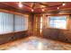 Sunroom with brick walls, tile floors, and lots of natural light at 888 Forest Glen Rd, Clearwater, FL 33765