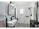 Sleek bathroom with modern fixtures, a glass-enclosed shower, and stylish decor at 931 28Th N Ave, St Petersburg, FL 33704
