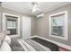 Bedroom showcasing ample natural light, hardwood floors, ceiling fan, and comfortable furnishings at 931 28Th N Ave, St Petersburg, FL 33704