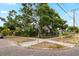 Charming home with mature trees, a fenced yard, and brick-paved streets at 931 28Th N Ave, St Petersburg, FL 33704