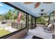 Inviting enclosed front porch with comfortable seating and ceiling fans at 931 28Th N Ave, St Petersburg, FL 33704