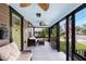 Inviting enclosed front porch with comfortable seating and ceiling fans at 931 28Th N Ave, St Petersburg, FL 33704