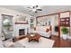 Inviting living room featuring a fireplace, ceiling fan, hardwood floors, and neutral color palette at 931 28Th N Ave, St Petersburg, FL 33704