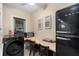 A practical work area equipped with vintage refrigerator and modern washer at 931 28Th N Ave, St Petersburg, FL 33704