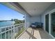 Balcony with a beautiful water view, white railings, and seating at 9939 1St E St, Treasure Island, FL 33706