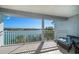 Balcony with a beautiful water view, white railings, and seating at 9939 1St E St, Treasure Island, FL 33706