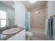 Bathroom with granite countertops, shower and tub combination, and tiled floors at 9939 1St E St, Treasure Island, FL 33706