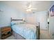 Comfortable bedroom with ceiling fan, nautical decor and carpeting at 9939 1St E St, Treasure Island, FL 33706