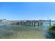 Well-maintained boat dock with multiple boat lifts, offering convenient access to the water for boating and recreation at 9939 1St E St, Treasure Island, FL 33706