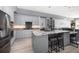 Gourmet kitchen featuring stainless steel appliances, custom cabinetry, and a spacious center island with bar seating at 9939 1St E St, Treasure Island, FL 33706