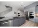 Modern kitchen with stainless appliances, a granite island, and easy access to the breakfast area at 9939 1St E St, Treasure Island, FL 33706