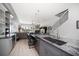 Modern kitchen with granite countertops, stainless steel appliances, a large island, and an open floor plan concept at 9939 1St E St, Treasure Island, FL 33706