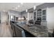 Beautiful kitchen with a large island, grey cabinets, a built in cabinet and modern stainless steel appliances at 9939 1St E St, Treasure Island, FL 33706