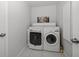 Bright laundry room features front load washer and dryer and tiled floors at 9939 1St E St, Treasure Island, FL 33706