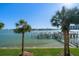 Picture of a waterfront featuring palm trees, boat slips, docks and beautiful blue water at 9939 1St E St, Treasure Island, FL 33706