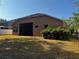 Home exterior showing a screened-in porch and lawn at 10212 Holland Rd, Riverview, FL 33578