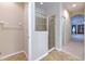 Bathroom featuring a glass-enclosed shower with tile surround and tile flooring, plus a ceiling light at 10212 Holland Rd, Riverview, FL 33578
