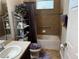 Hall bathroom with a tub/shower combination and storage shelving at 10212 Holland Rd, Riverview, FL 33578