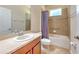 Bathroom with shower over tub and large mirror at 10212 Holland Rd, Riverview, FL 33578