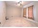 A cozy bedroom with neutral carpet, a ceiling fan, and curtains, ready for personal touches at 10212 Holland Rd, Riverview, FL 33578