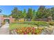 Community entrance to Avelar Creek with landscaped flower beds and brick pillars at 10212 Holland Rd, Riverview, FL 33578