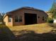 Back of home featuring a large screened-in lanai area at 10212 Holland Rd, Riverview, FL 33578