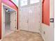 Welcoming foyer featuring double front doors, tile flooring, and neutral walls with contrasting color accents at 10212 Holland Rd, Riverview, FL 33578