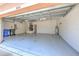 Spacious two-car garage with an automatic door, painted floor, and ample storage space at 10212 Holland Rd, Riverview, FL 33578