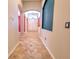Hallway showcasing decorative tiled flooring, arched doorways, and a view of the front entrance at 10212 Holland Rd, Riverview, FL 33578