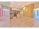 Bright and open kitchen with granite countertops and stainless steel appliances at 10212 Holland Rd, Riverview, FL 33578