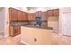 Kitchen featuring granite counters, stainless appliances, and bar seating at 10212 Holland Rd, Riverview, FL 33578