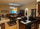 Open kitchen area with modern appliances, a breakfast bar, and a view of the living room at 10212 Holland Rd, Riverview, FL 33578