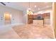 Open-concept kitchen with pendant lighting, tile floors, and modern appliances at 10212 Holland Rd, Riverview, FL 33578