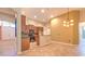 Well-lit kitchen with tile flooring, wooden cabinets, and an open design at 10212 Holland Rd, Riverview, FL 33578