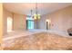 Bright living room featuring sliding glass doors to the backyard at 10212 Holland Rd, Riverview, FL 33578
