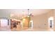 Bright living space with tile flooring, ceiling fan, and open concept design at 10212 Holland Rd, Riverview, FL 33578