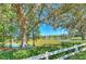 Community view of the pond with a water feature, surrounded by lush greenery at 10212 Holland Rd, Riverview, FL 33578