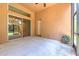 View of the spacious screened patio with a ceiling fan and sliding glass door at 10212 Holland Rd, Riverview, FL 33578