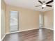 Bedroom featuring natural light, wood-look flooring, and neutral color scheme at 1200 Tarpon Woods Blvd # M8, Palm Harbor, FL 34685