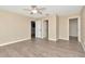 Bedroom with neutral color scheme, closet, and access to ensuite bathroom at 1200 Tarpon Woods Blvd # M8, Palm Harbor, FL 34685