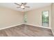 Simple bedroom featuring two large windows, neutral paint, and flooring at 1200 Tarpon Woods Blvd # M8, Palm Harbor, FL 34685
