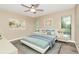 Serene bedroom with bright, natural light, modern furniture, and stylish decor at 1200 Tarpon Woods Blvd # M8, Palm Harbor, FL 34685