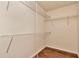 Walk-in closet with wood floors and metal shelving at 1200 Tarpon Woods Blvd # M8, Palm Harbor, FL 34685