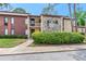 Charming condo with stone facade and well-maintained landscaping at 1200 Tarpon Woods Blvd # M8, Palm Harbor, FL 34685