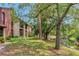 Property exterior with a view of the lake and mature trees at 1200 Tarpon Woods Blvd # M8, Palm Harbor, FL 34685