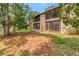 Back of building showing screened patios and stone wall feature at 1200 Tarpon Woods Blvd # M8, Palm Harbor, FL 34685