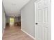 Inviting hallway with wood flooring leading to living area at 1200 Tarpon Woods Blvd # M8, Palm Harbor, FL 34685