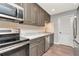 Kitchen features stainless steel appliances and marble countertops at 1200 Tarpon Woods Blvd # M8, Palm Harbor, FL 34685