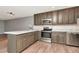 Modern kitchen featuring stainless steel appliances and stylish cabinets at 1200 Tarpon Woods Blvd # M8, Palm Harbor, FL 34685