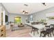 Open-concept living and dining area with natural light at 1200 Tarpon Woods Blvd # M8, Palm Harbor, FL 34685